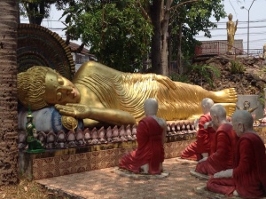 Large reclining Buddha statue in Phayao, Thailand. The reclining Buddha image is symbolic of reaching nirvana.